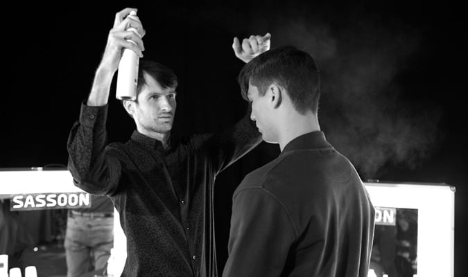 Sassoon Stylist Michael Pilz Cutting Back Stage At A Fashion Show