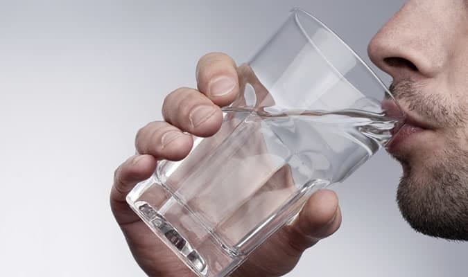 Drink lots of water to help keep your skin hydrated when flying
