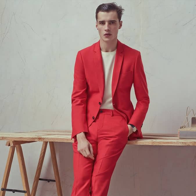 Man in a bold coloured red suit