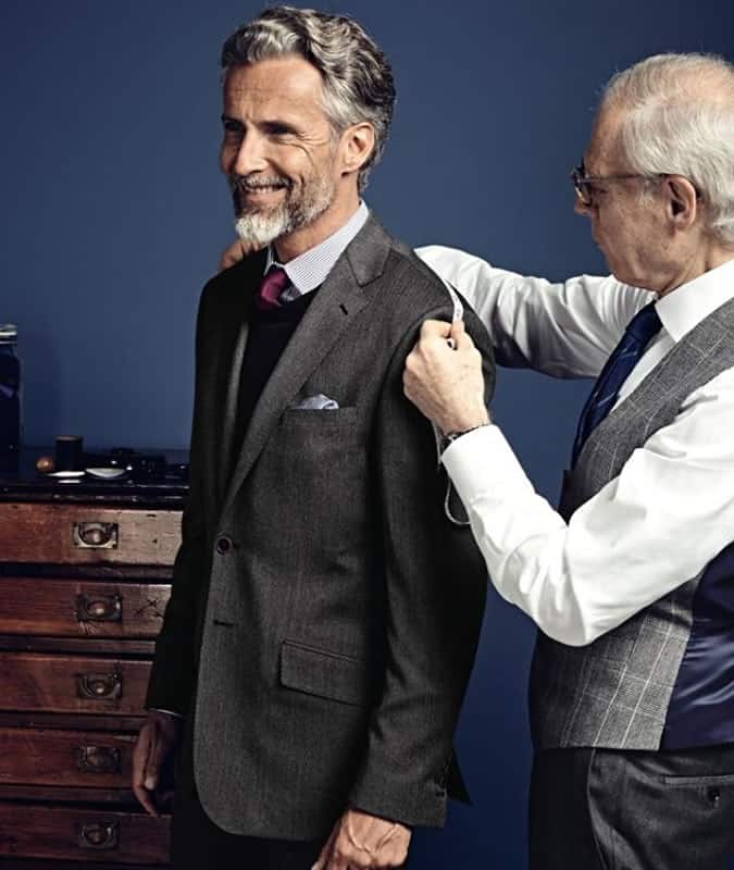 Man Being Fitted For A Suit By A Tailor