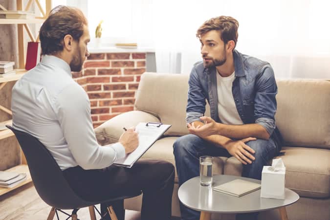 Man talking to psychiatrist
