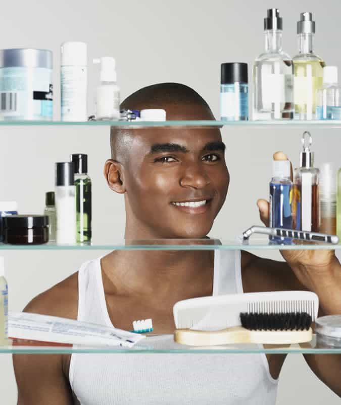 Man in front of organised grooming cabinet