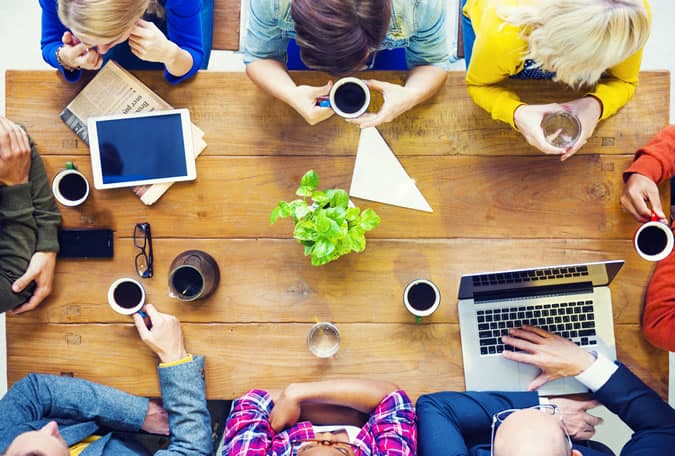 People working at a table in a startup business