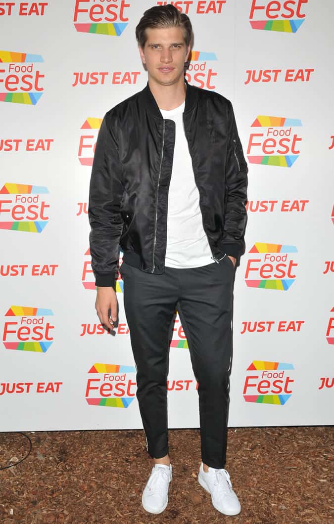 Toby Huntington-Whiteley wearing a bomber jacket and trousers