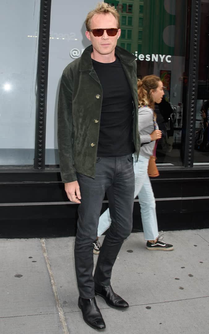 Paul Bettany wearing a green suede jacket