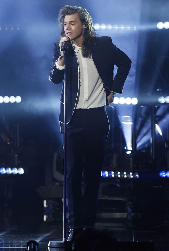 Harry Styles wearing a suit without a tie