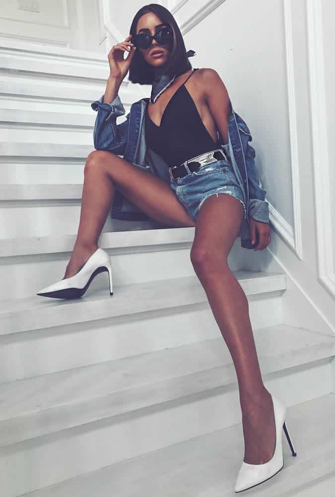 Olivia Culpo wearing cut-off denim shorts