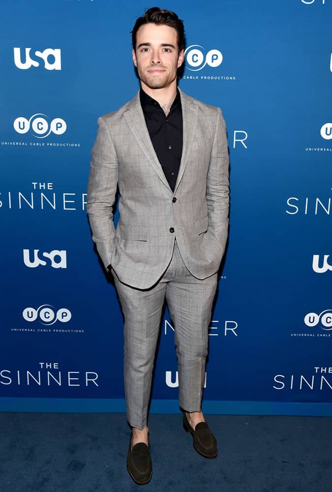 Corey Cott dressed in a grey suit at The Sinner Premiere