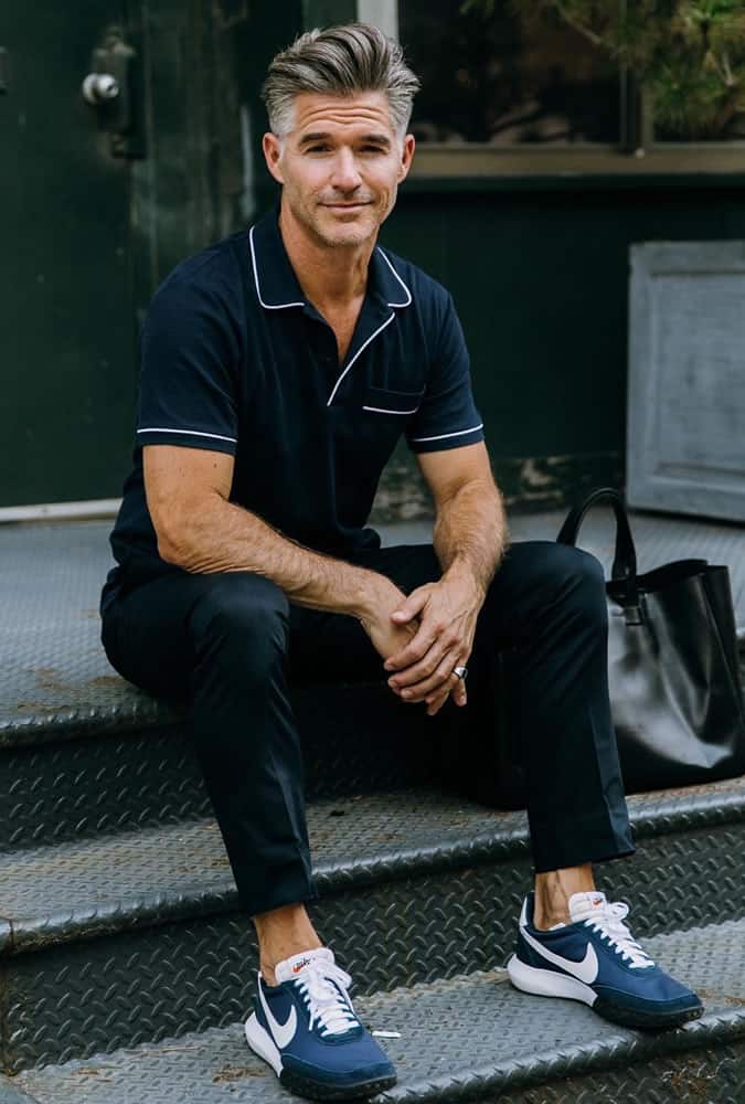 Eric Rutherford wearing an all-navy outfit