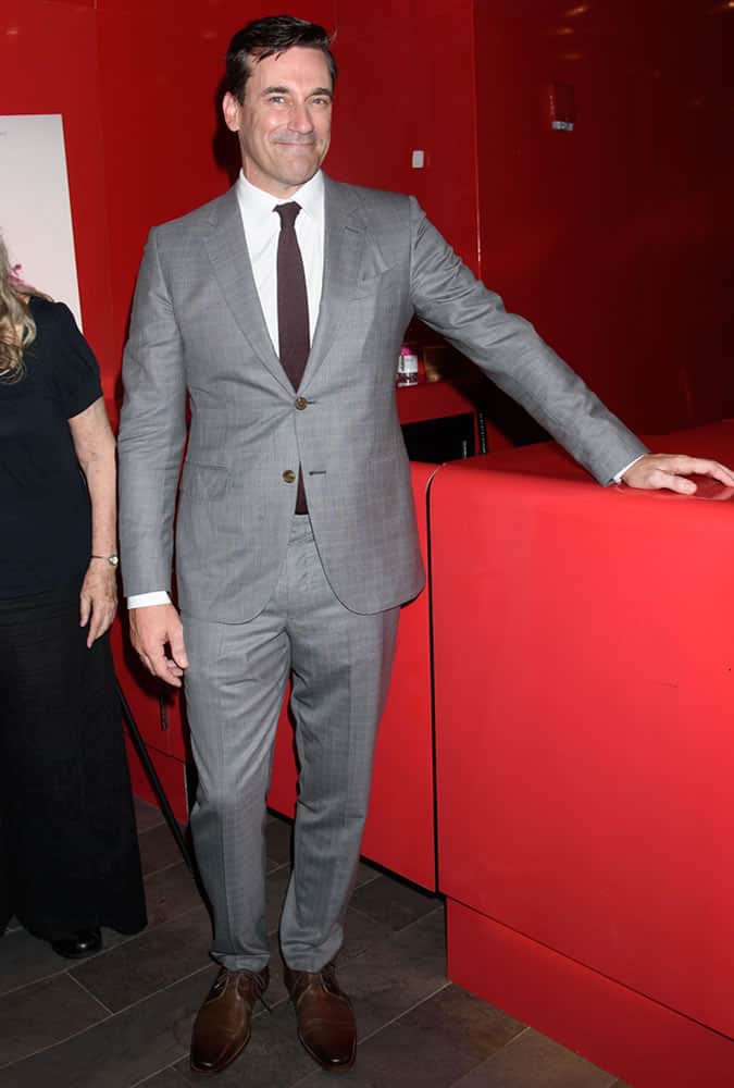 Jon Hamm dressed in a check suit