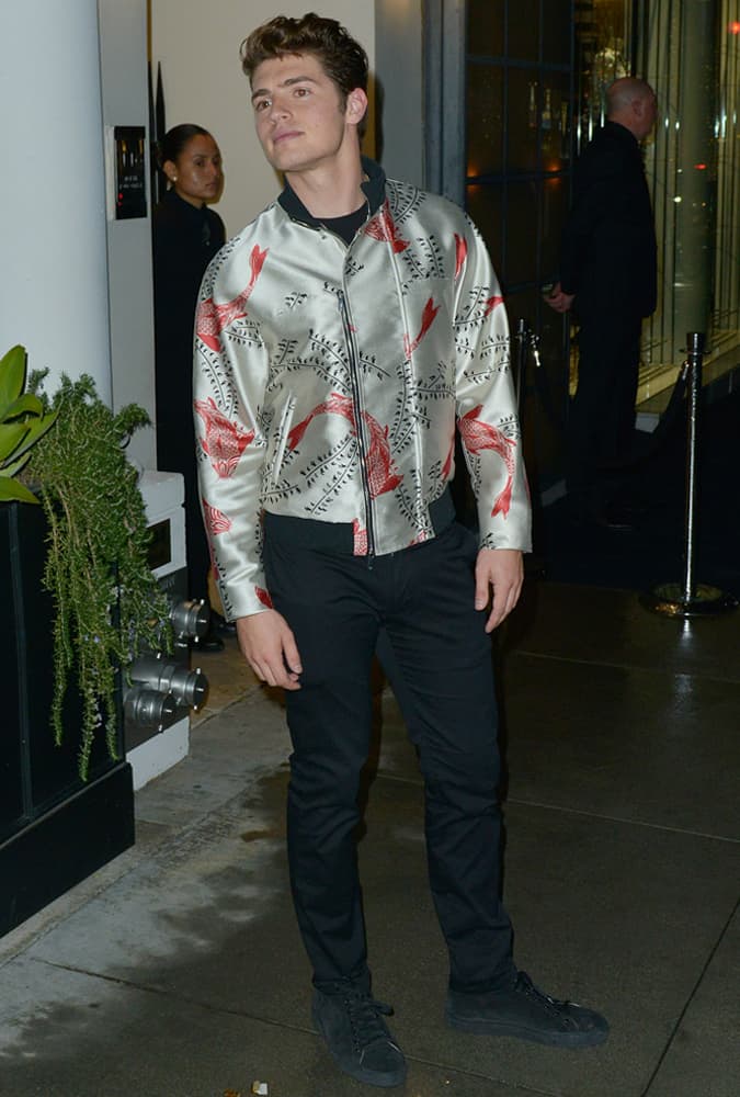 Gregg Sulkin Wearing A Satin Biker Jacket