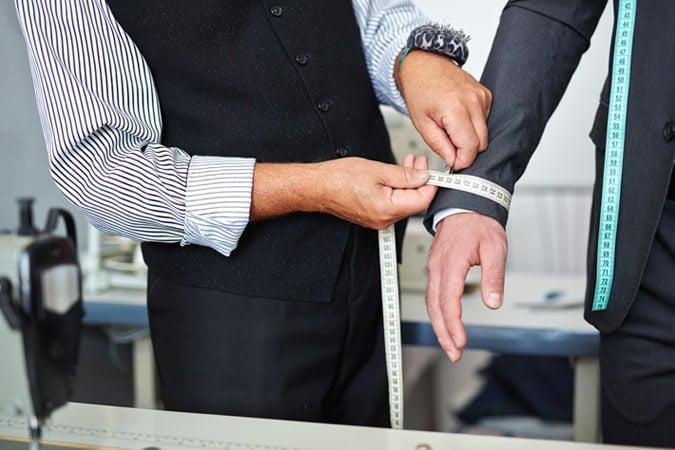 Being Measured By A Tailor
