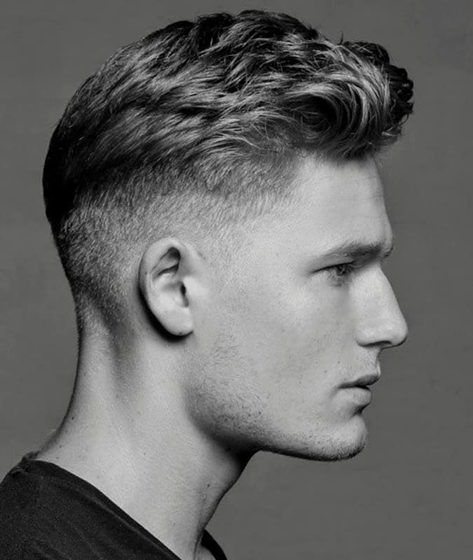 Men's Pompadour hairstyle with a Taper fade