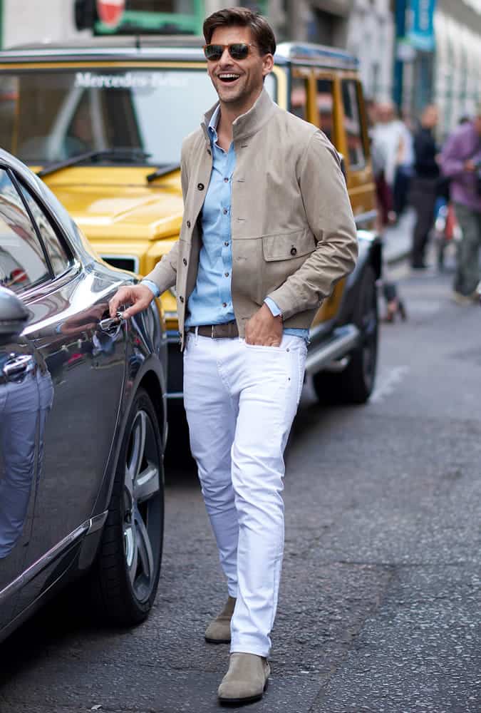 Johannes Hubel in white jeans with a suede bomber jacket
