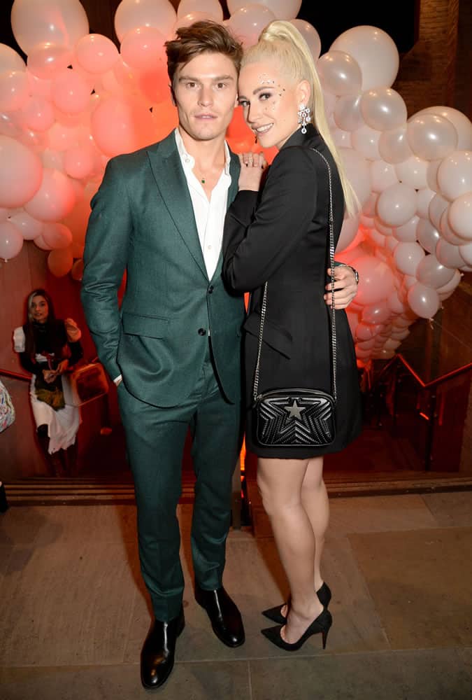 Oliver Cheshire Wearing a Green Suit