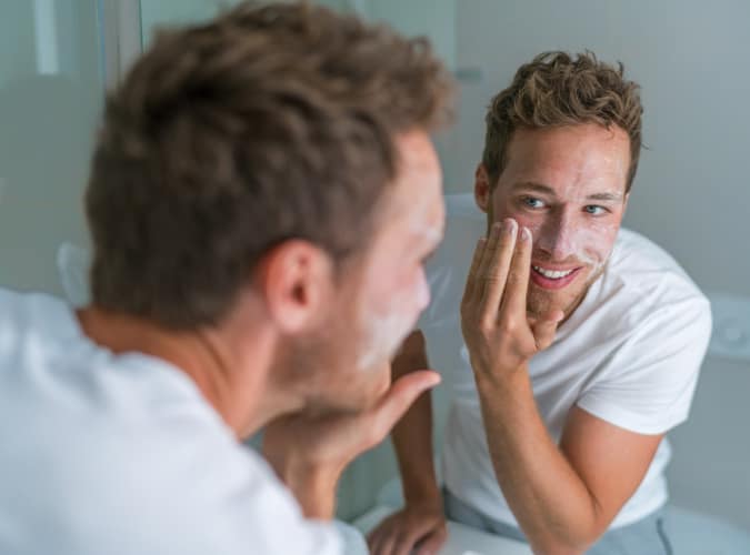 Man washing his face