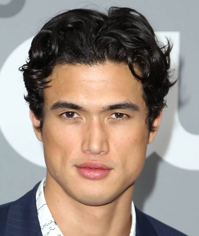 Charles Melton curly curtain hairstyle