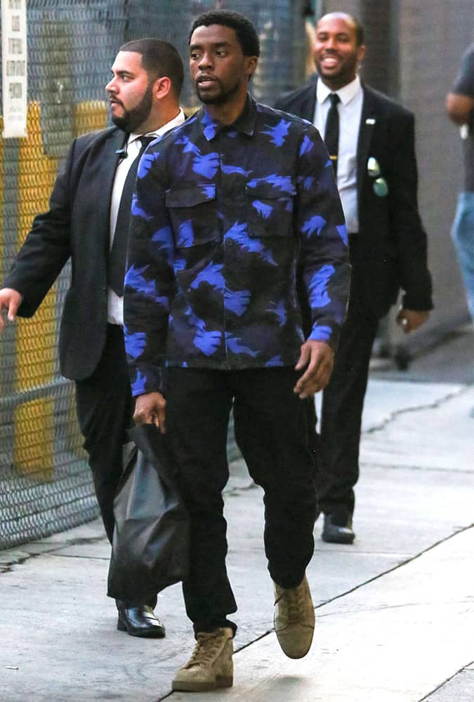 Chadwick Boseman wearing a black and blue printed top