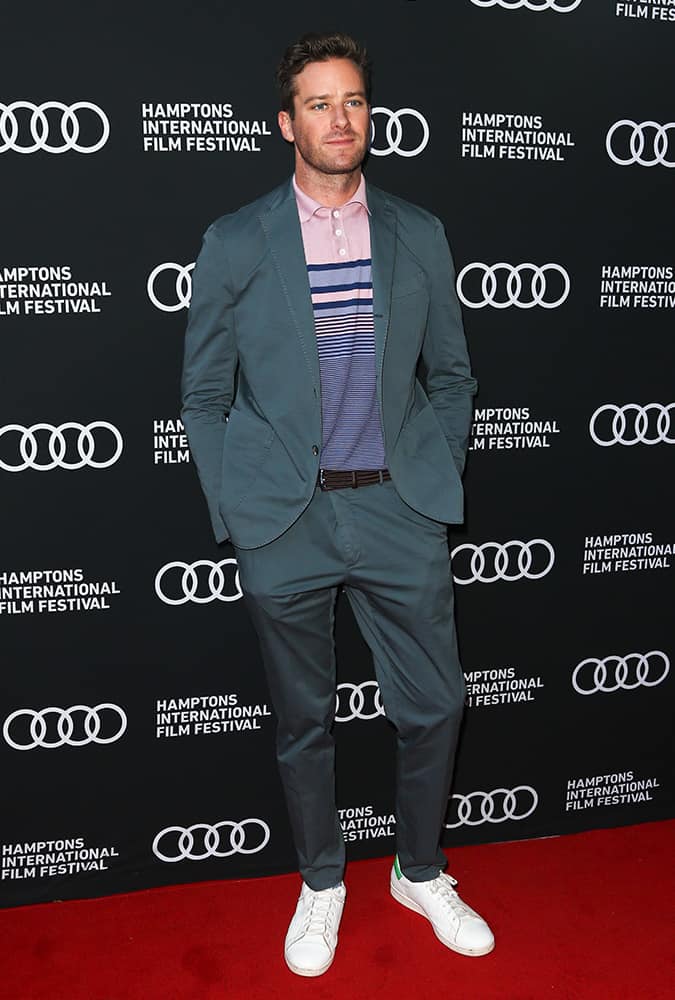 Armie Hammer wearing a green suit