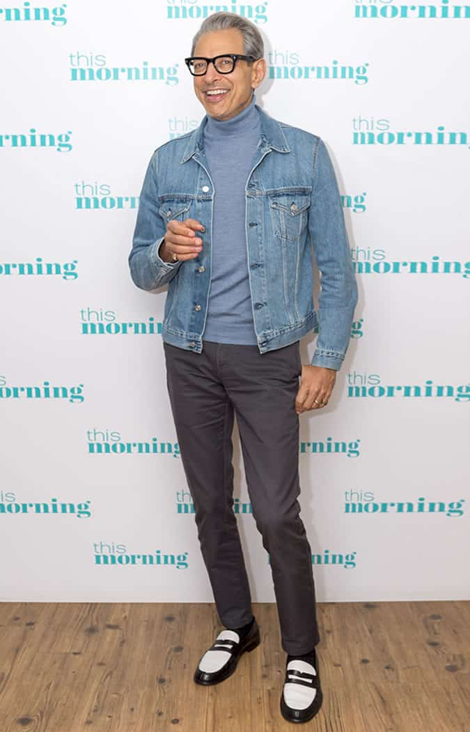 Jeff Goldblum wearing a denim jacket and grey trousers on This Morning
