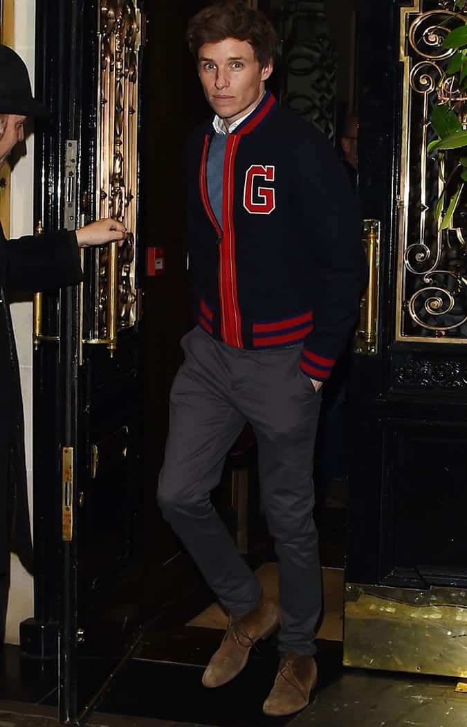 Eddie Redmayne wearing a varsity jacket