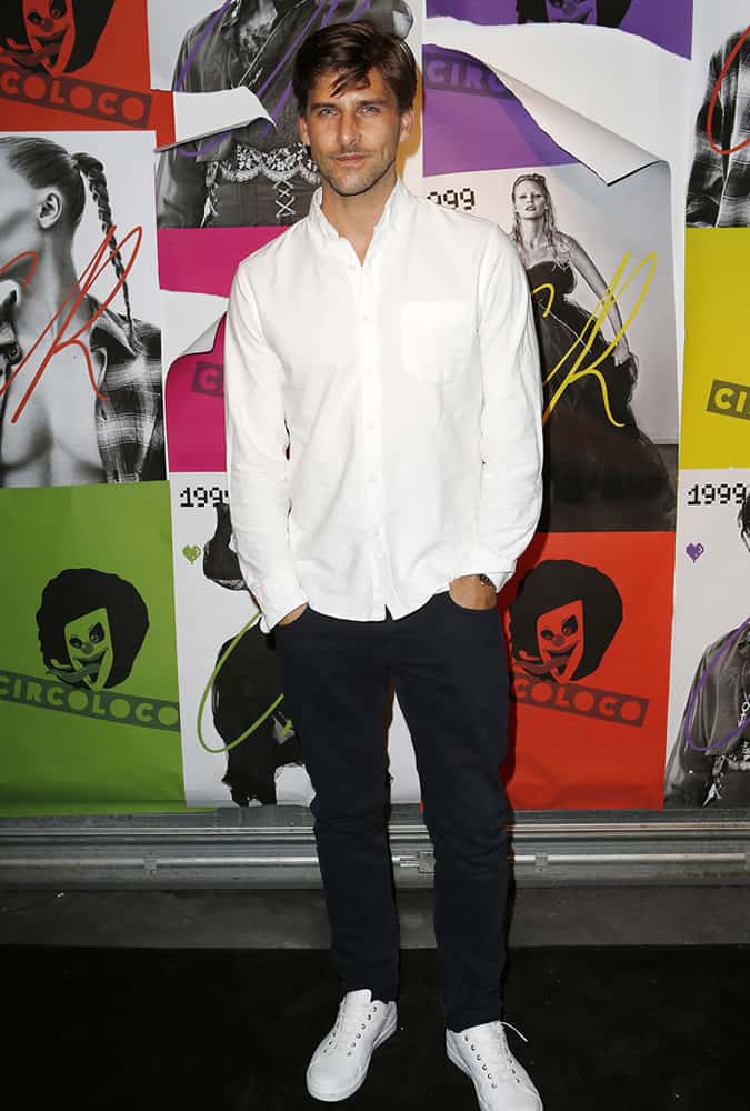 Johannes Huebl wearing a white shirt at Paris Fashion Week