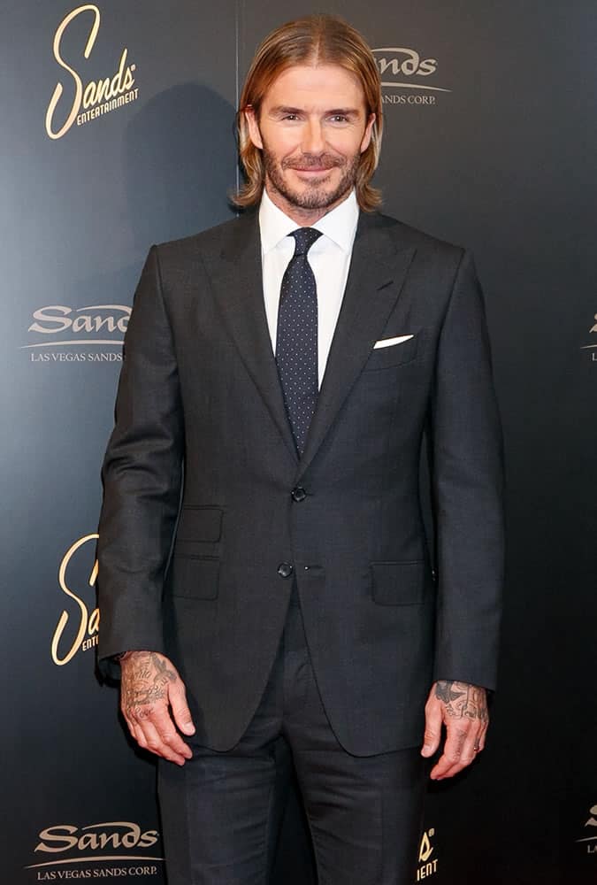 David Beckham with long hair wearing a suit
