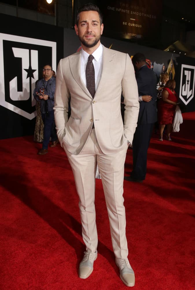 Zachary Levi wearing a tan suit at the Justice League premiere