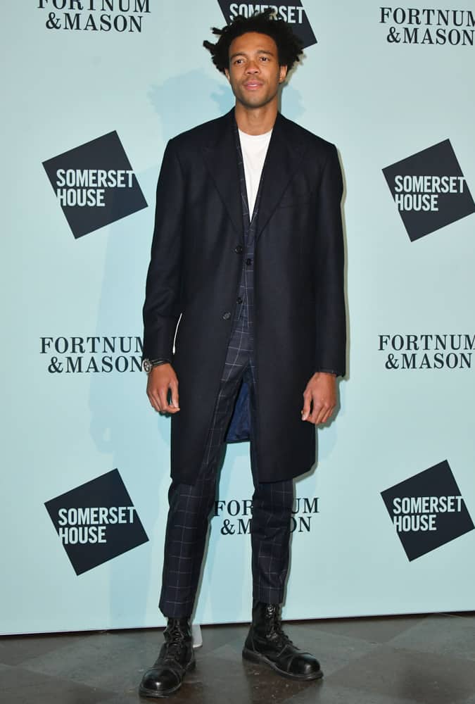 Charlie Casely-Hayford wearing a check suit and navy overcoat