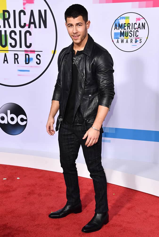 Nick Jonas Wearing A Black Leather Biker Jacket