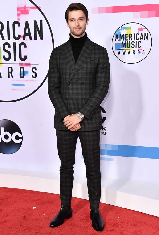 Patrick Schwarzenegger Wearing A Check Charcoal Suit And Black Roll Neck