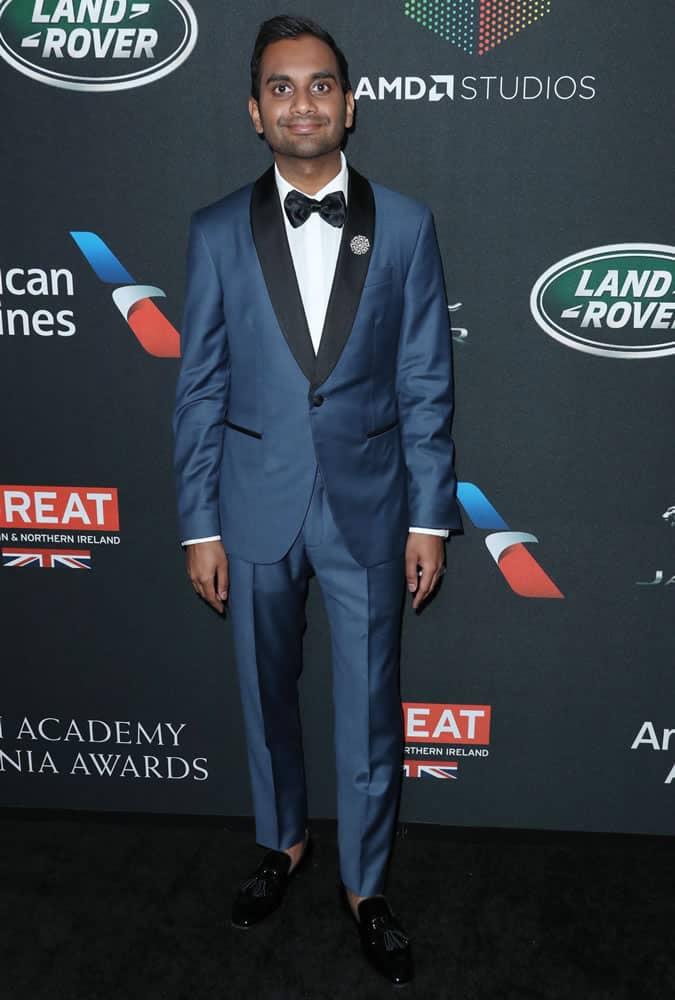 Aziz Ansari wearing a blue dinner jacket