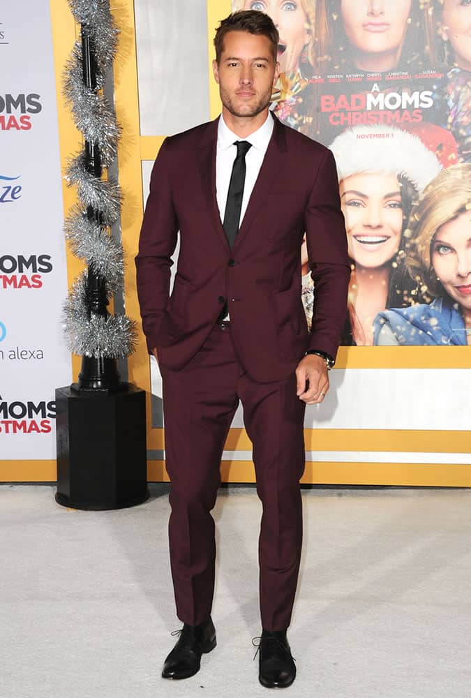 Justin Hartley wearing a a burgundy suit