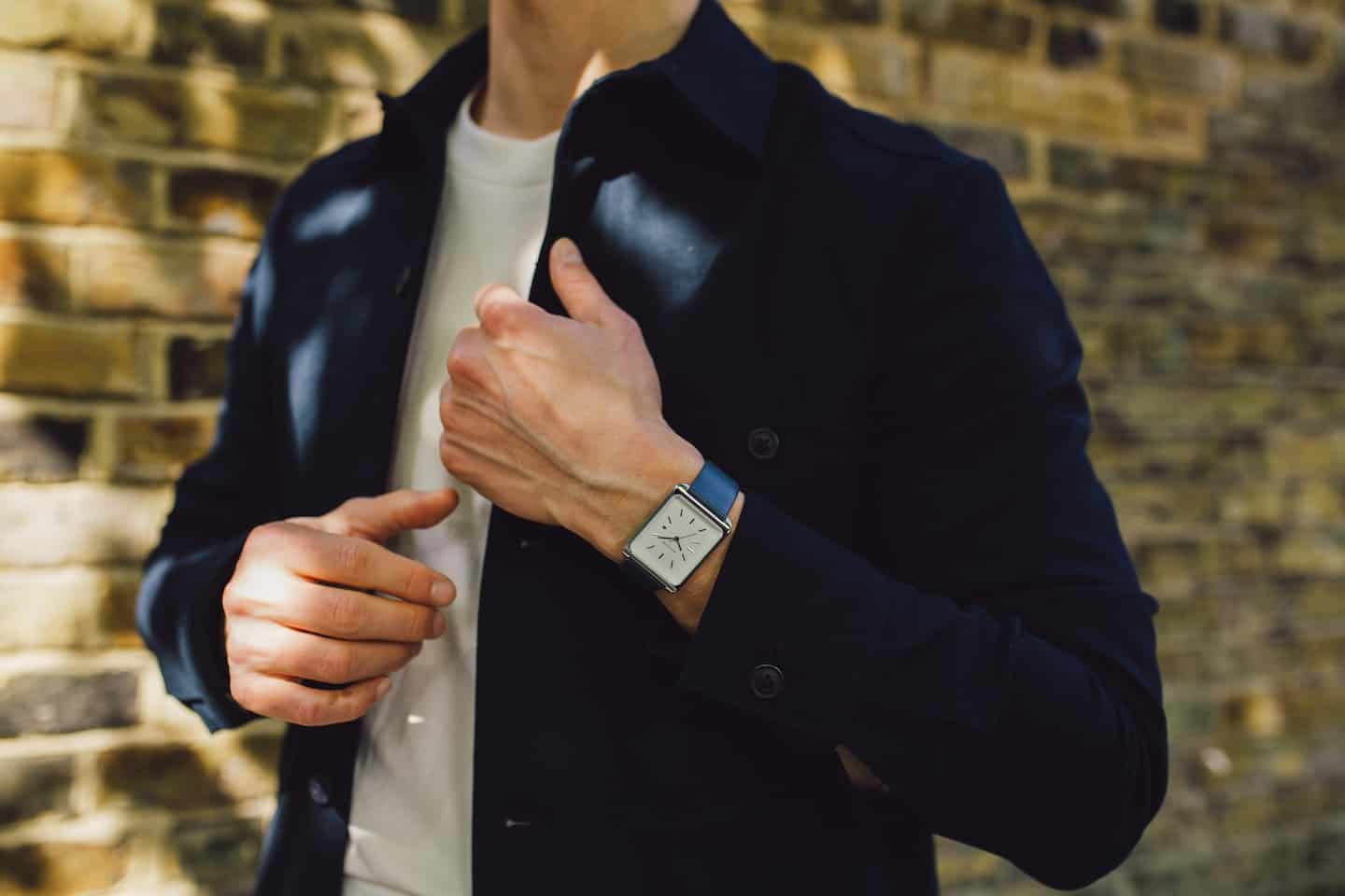 well dressed man wearing a watch