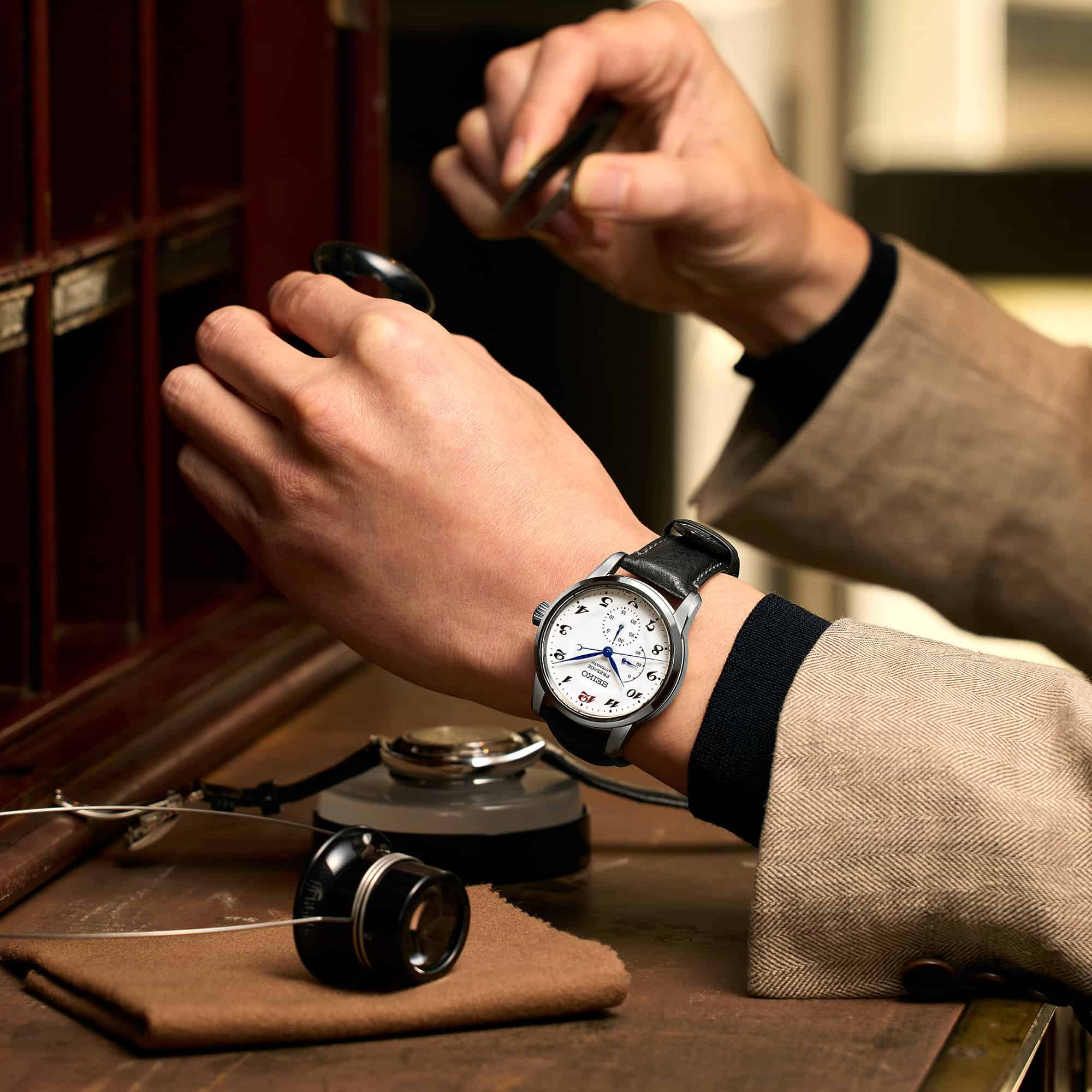 man checking a watch for servicing
