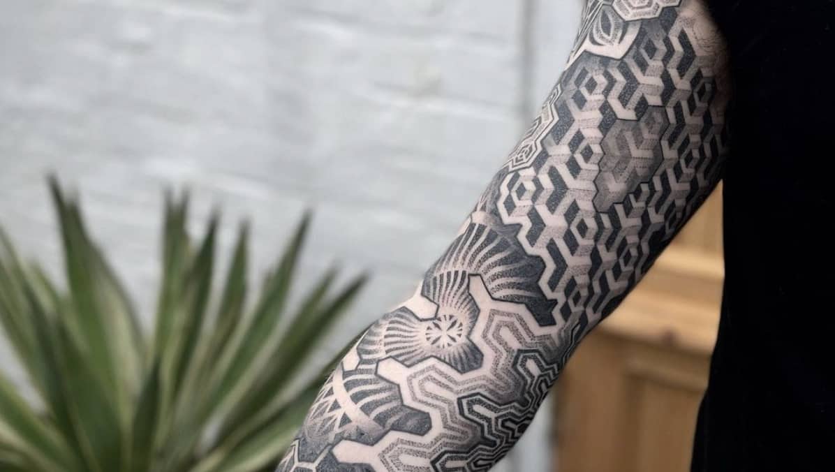 Geometric and blackout sleeves tattoo