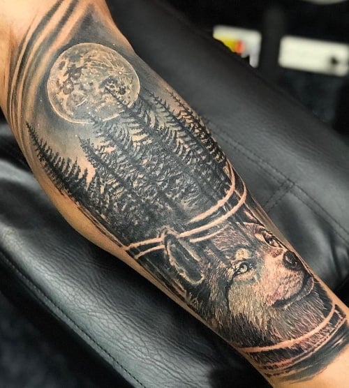 Wolf in woods tattoo