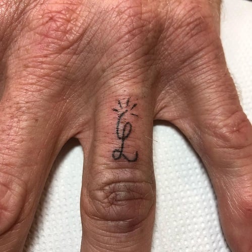 Stick and Poke Finger Tattoo