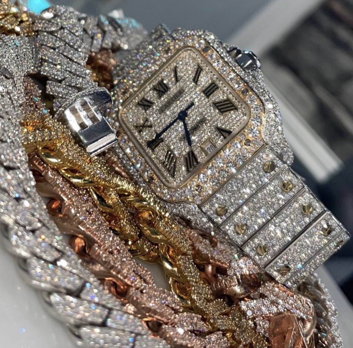 diamond watch on top of diamond bracelets