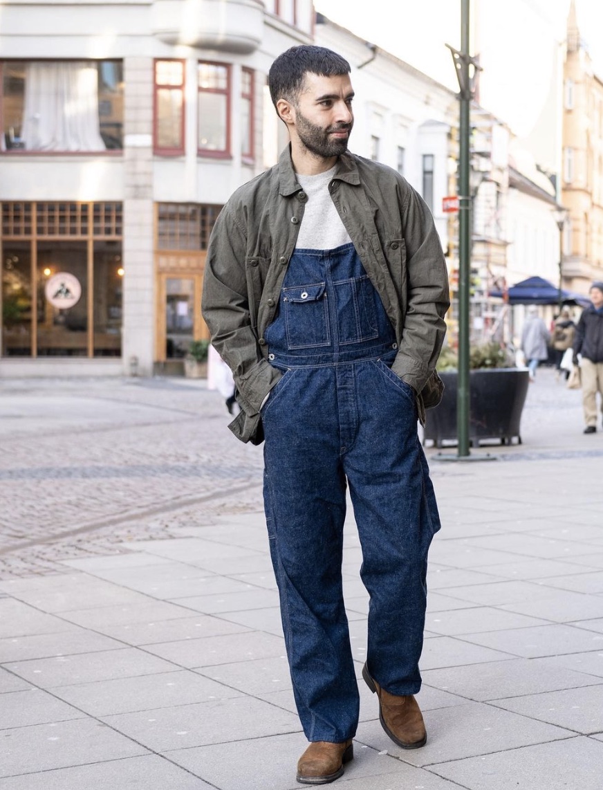 Man in overalls wearing chelsea boots