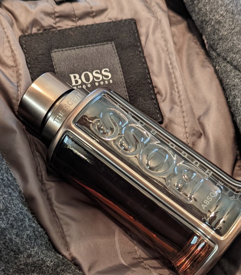 bottle of hugo boss cologne on a hugo boss jacket