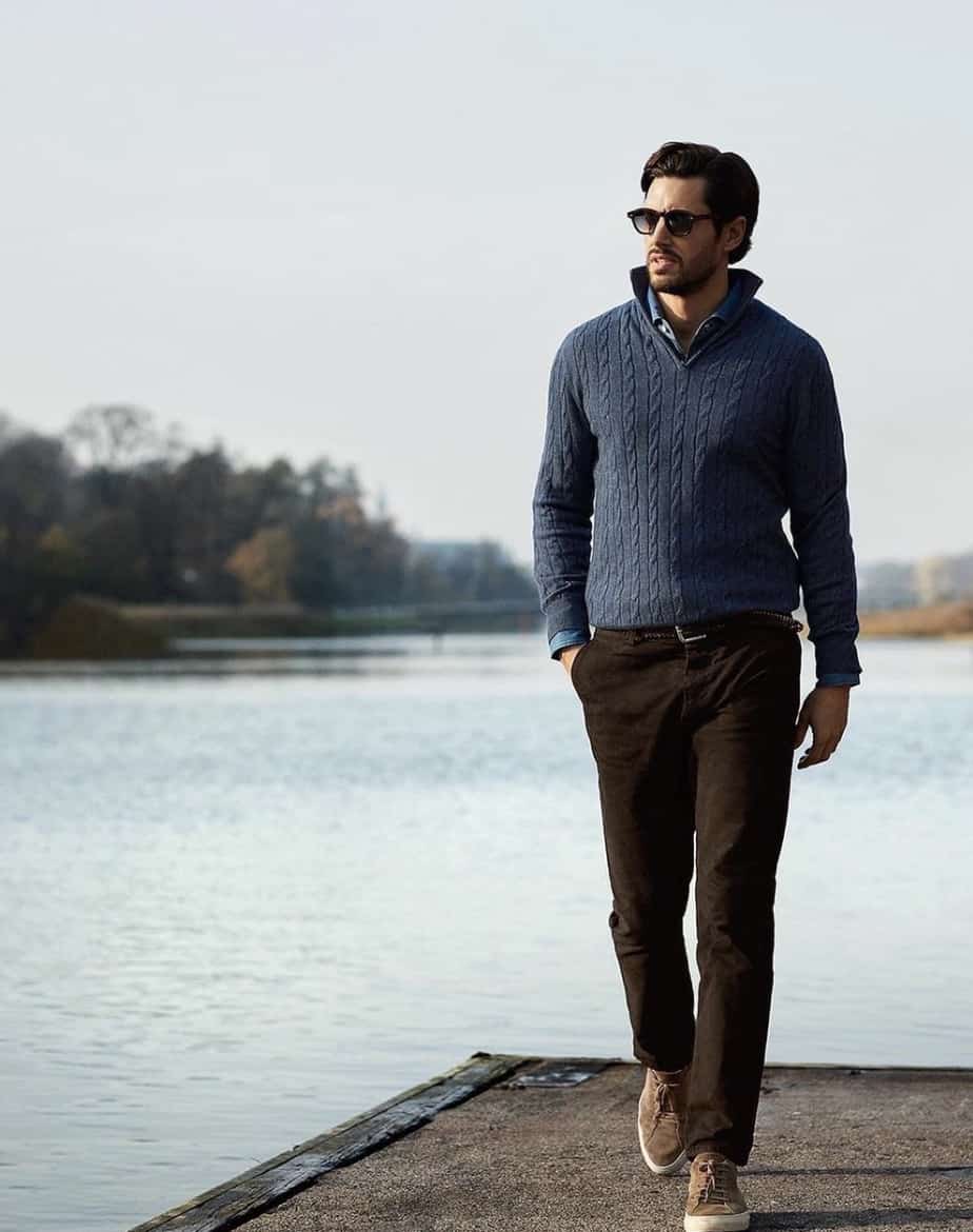 Man walking on a dock on a lake, modeling Luca Faloni Clothes 