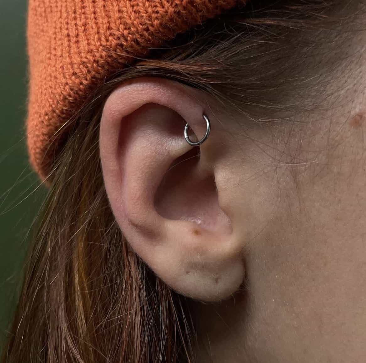 close up of a forward helix piercing 
