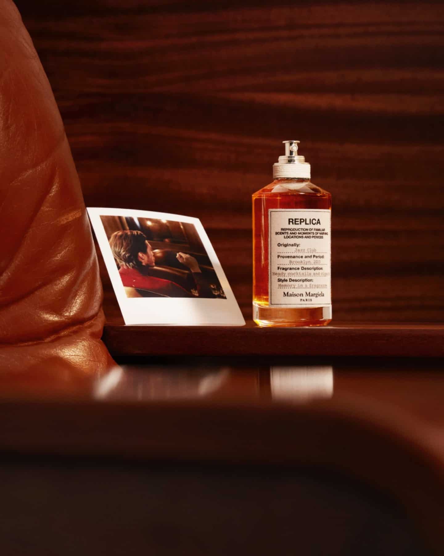 a bottle of vanilla cologne sitting on top of an armrest