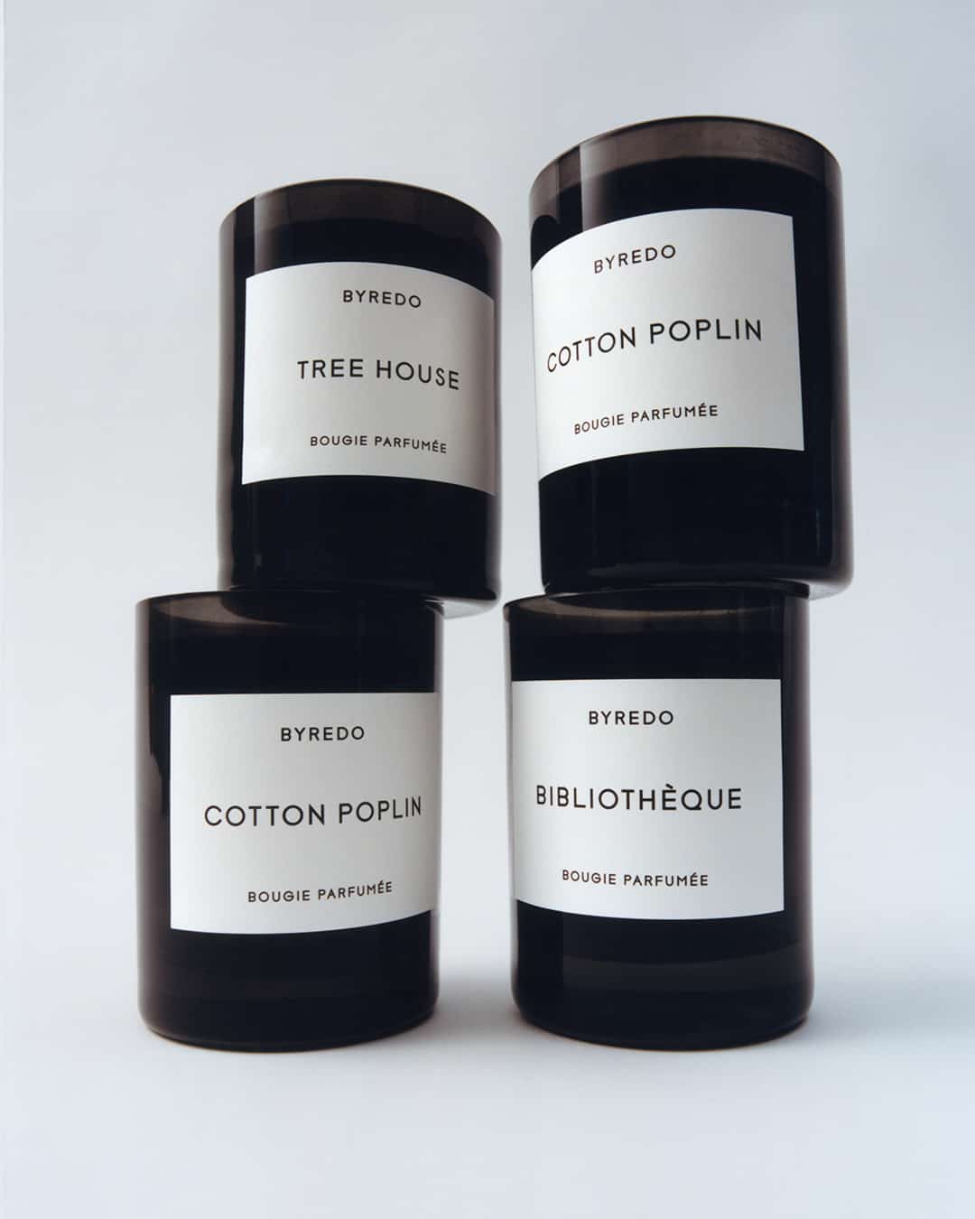 scented candles in black glass by Byredo