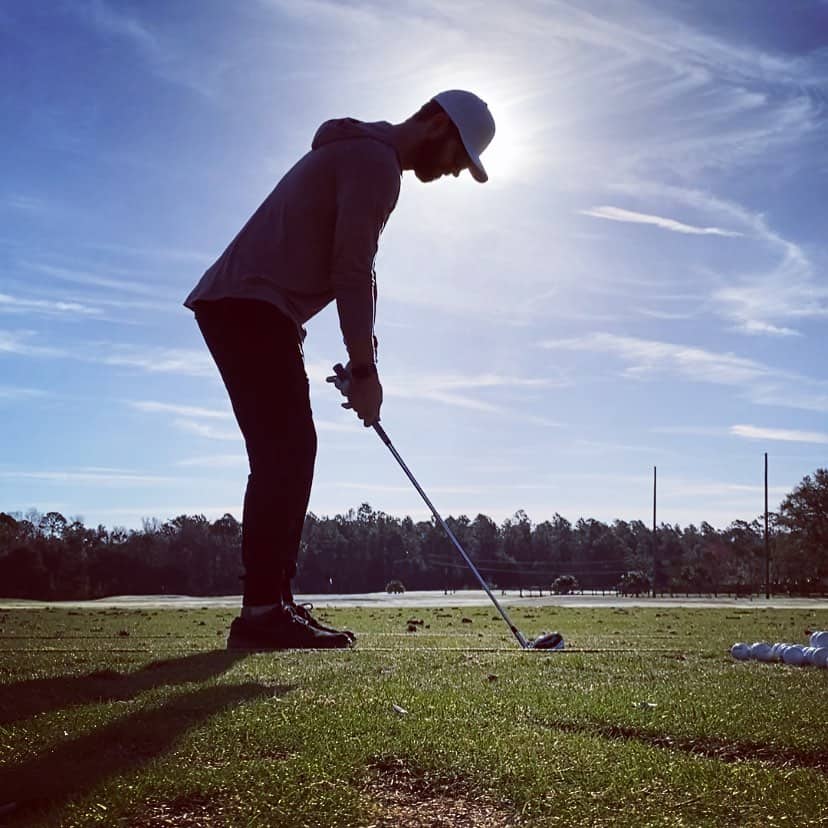 man practicing his swing