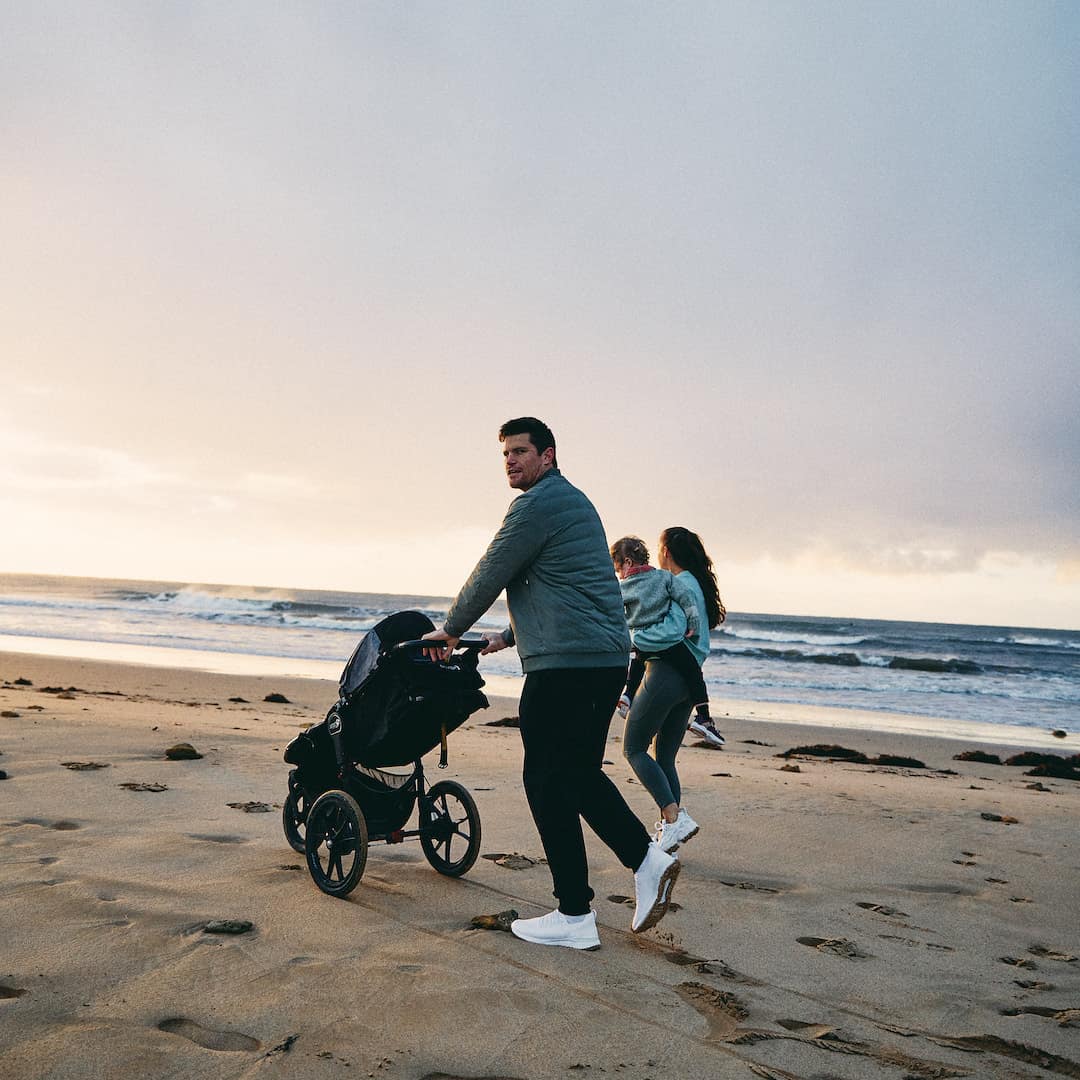 a family walking by the shore