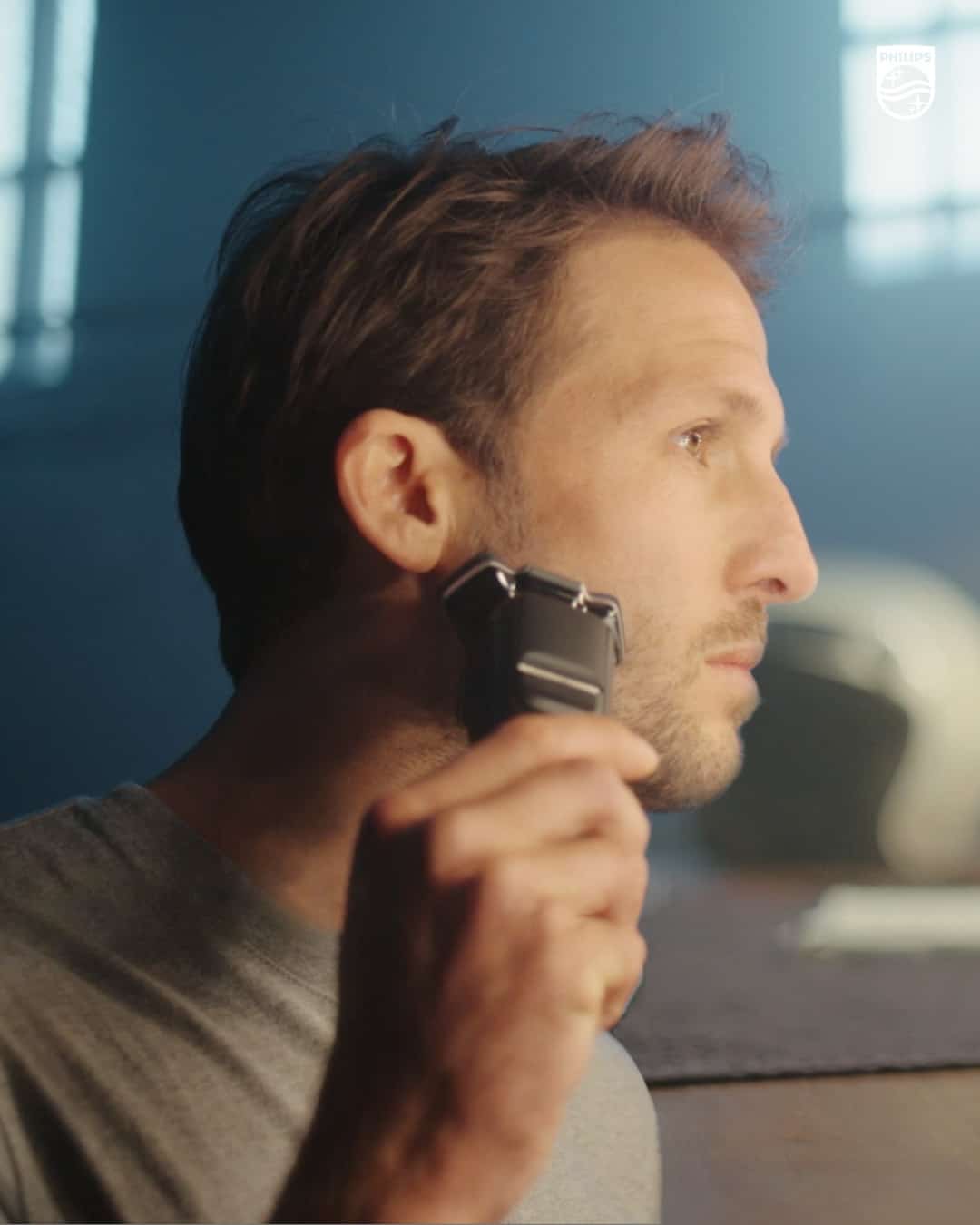 man using a norelco shaver