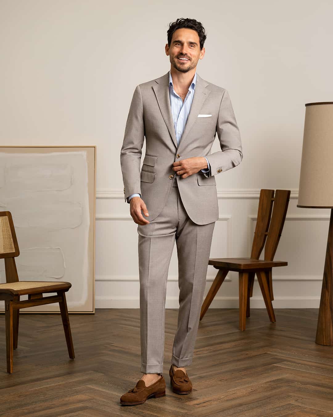 man in grey suit and brown shoes