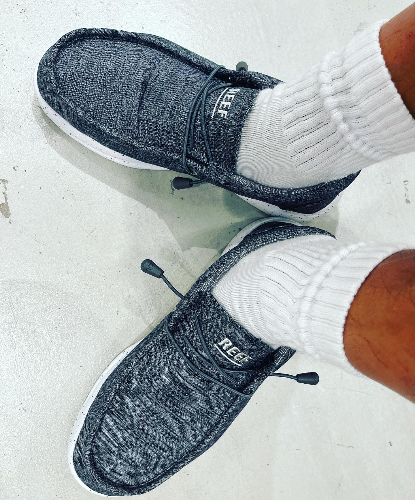 wearing a pair of reef loafers